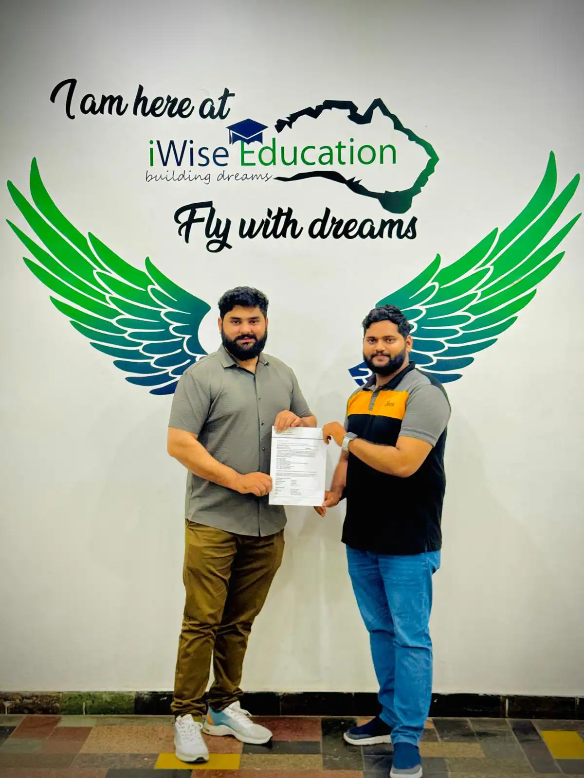 Yousaf Khan handing over a student visa